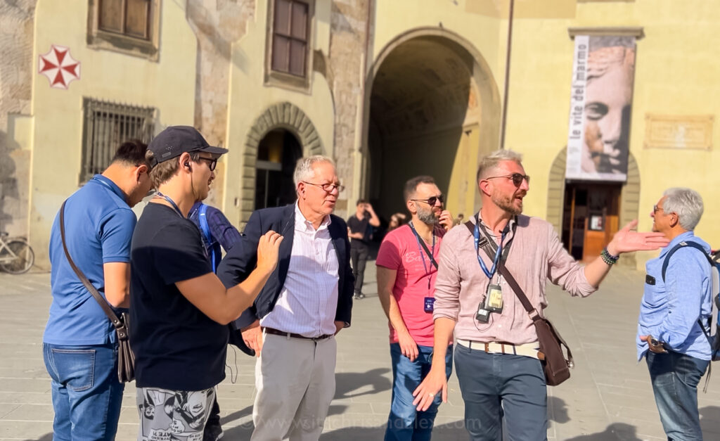 Francesco of Queer Tuscany Tours detailing history in Piazza dei Cavalieri