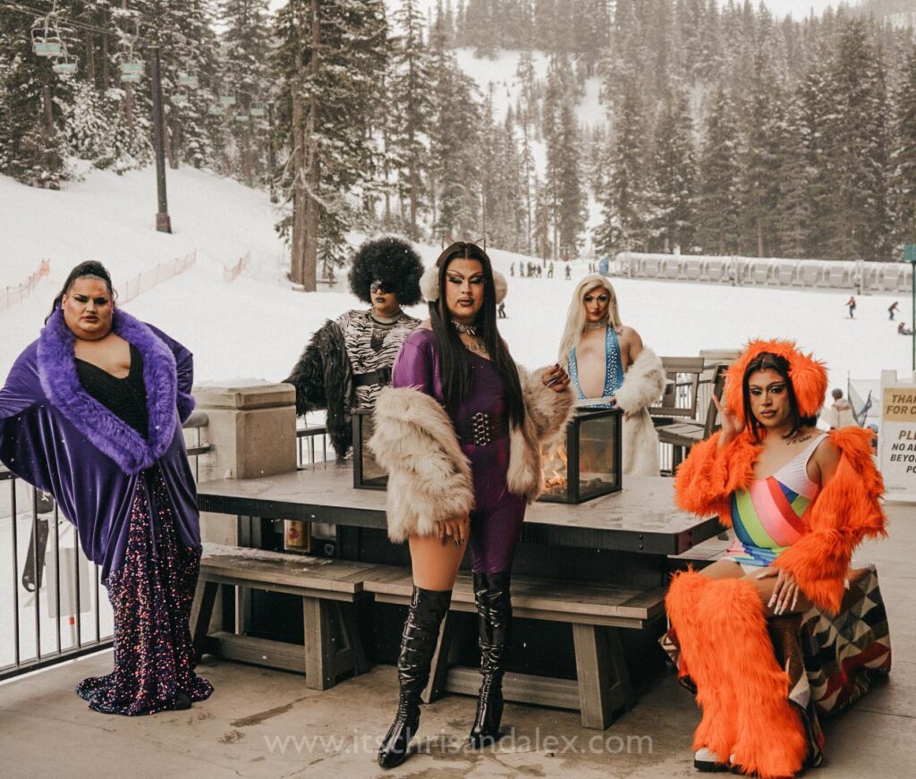 Diva Drag Brunch queens Jalya Rose, Slutashia, Aspen Meadows, Boujee Cherry, and Lylac around a fire pit at Mt.Hood Meadows during Hood River's inaugural Winter Pridefest.